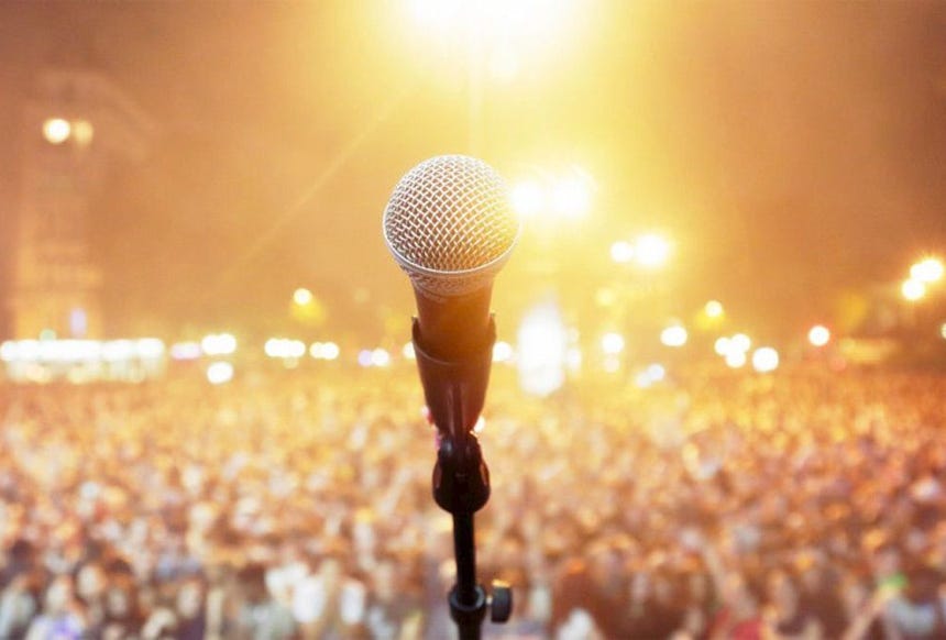 A surrealist scene of a floating desk with computers and toilets in a vibrant wetland at sunset.